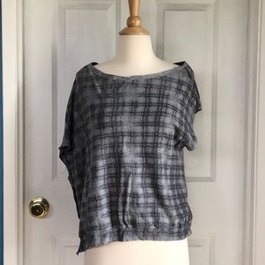 Inhabit top